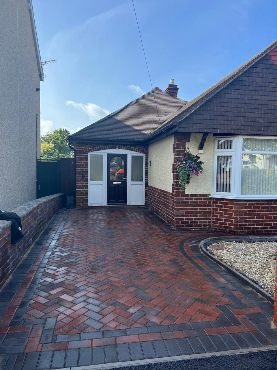 Block paved parking area in Heswall.